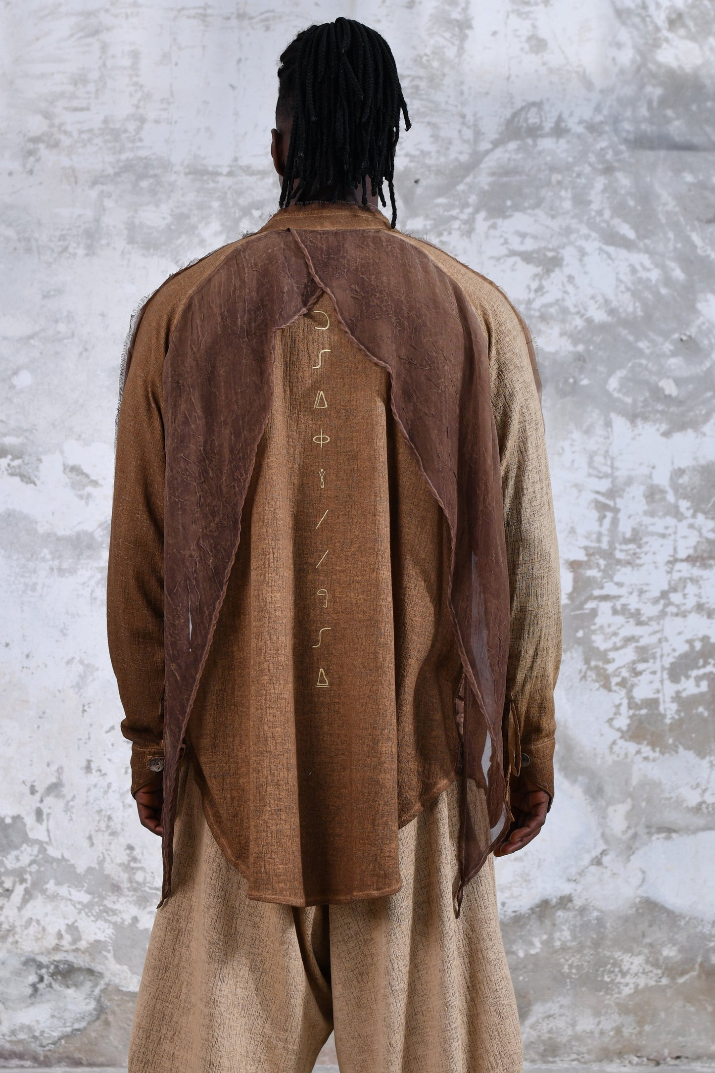 Sand boho men's shirt with alchemy and warrior designs, unique spiritual men's shirt made from soft cotton fabric, conscious clothing for men featuring cruelty-free materials, handcrafted bohemian-style men's shirt with chakra symbols, sustainable men's fashion, men's alchemist warrior shirt with chakra-inspired designs, mindful men's shirt made with eco-friendly materials, comfortable and stylish men's shirt with a spiritual touch, ethical and sustainable men's clothing with unique designs.