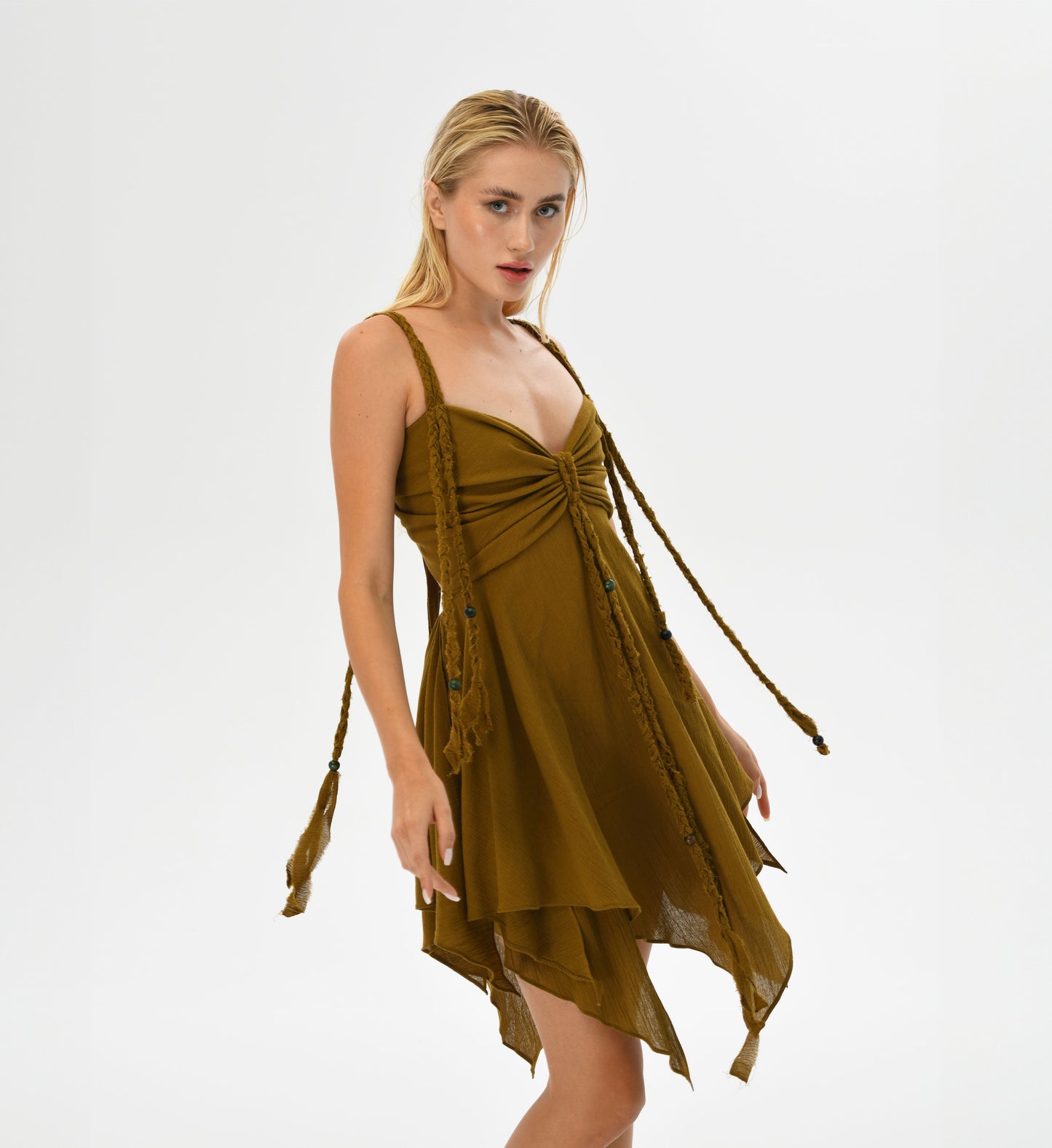 Ninsun Mini Dress in earthy brown, crafted from Turkish cotton with hand-braided embellishments. The corset-like top and adjustable back offer comfort and style, making this dress ideal for boho-chic fashion lovers.