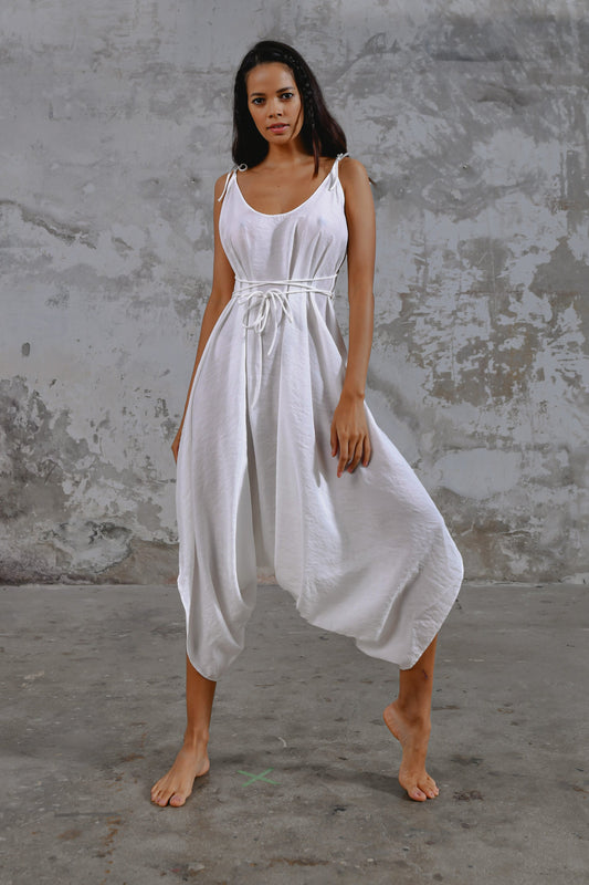 White boho goddess jumpsuit, loose fit jumpsuit, bohemian style jumpsuit, oversized jumpsuit, comfortable jumpsuit, casual jumpsuit, stylish jumpsuit, unique jumpsuit, handmade jumpsuit, sustainable fashion, eco-friendly jumpsuit, ethical clothing, versatile jumpsuit, one-piece outfit, summer jumpsuit, vacation outfit, travel-friendly jumpsuit, festival wear, statement piece, fashion-forward jumpsuit, timeless design.