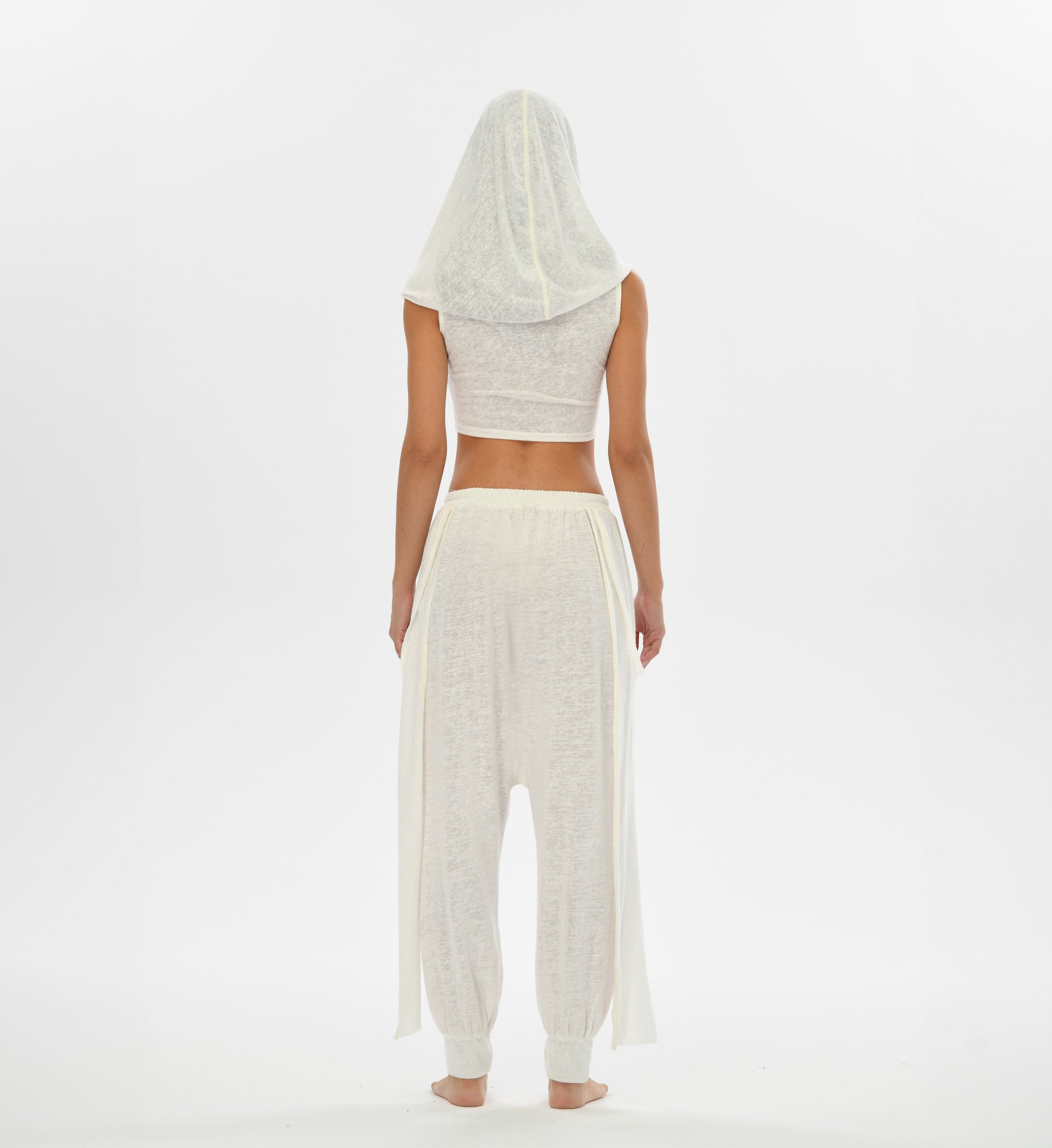 Mythical white hooded top with versatile oversized hood that can transform into a shawl, ideal for boho looks.