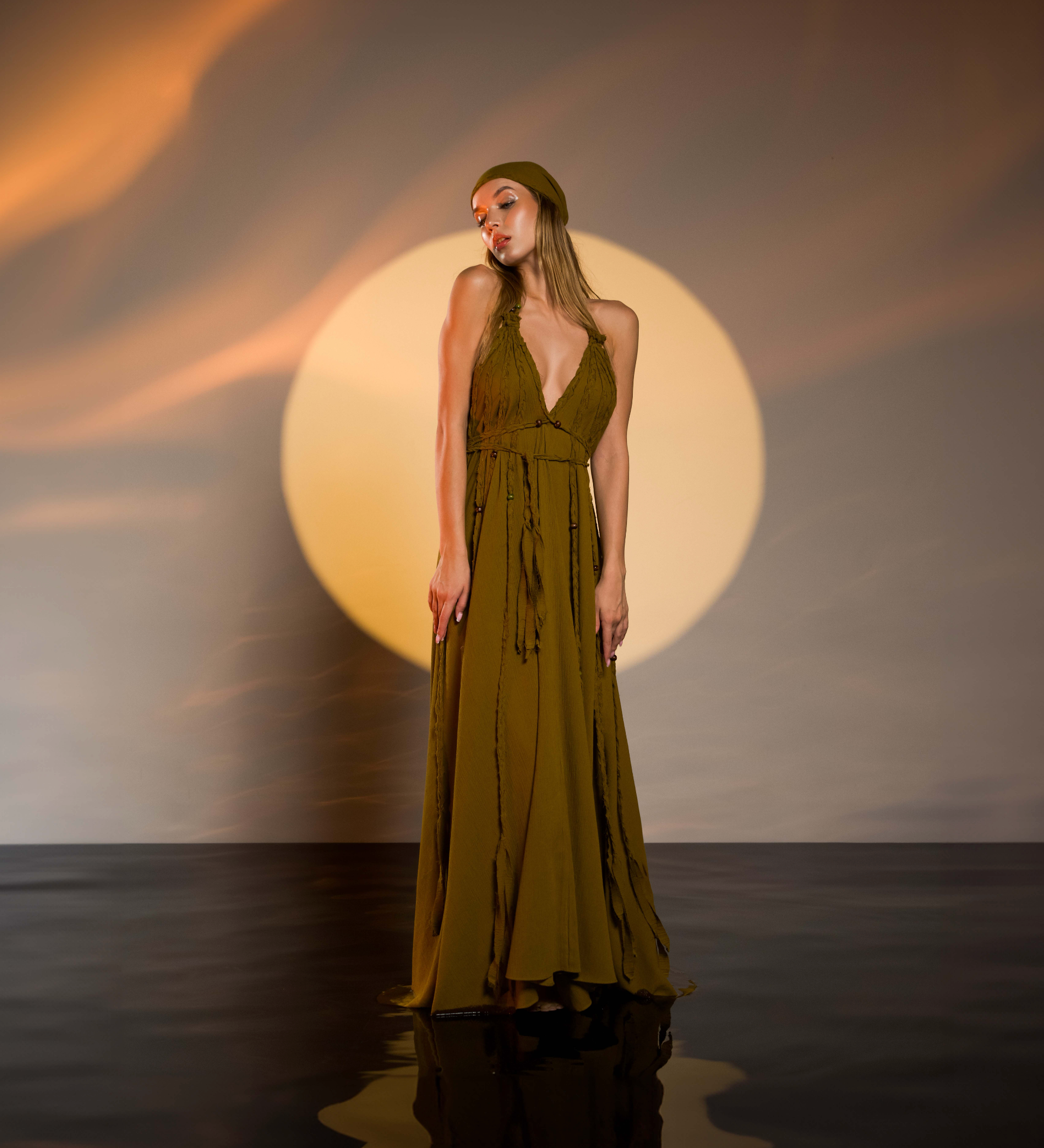 Boho chic brown maxi dress with a relaxed fit, hand-braided details, and open-back style. Ideal for weddings, festivals, and resort vacations.