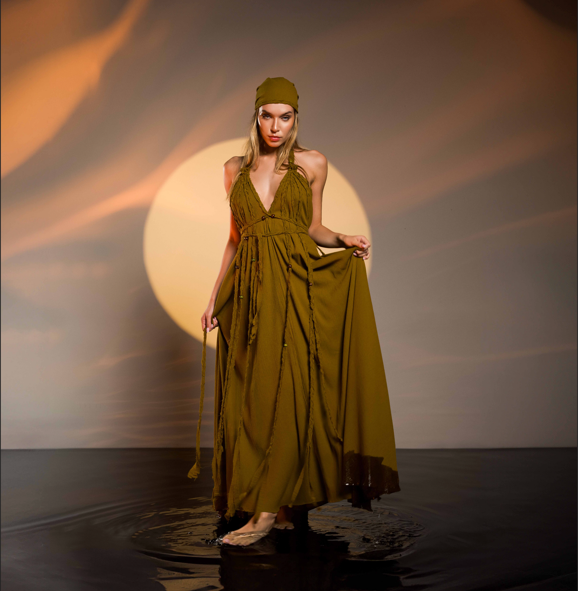 Boho festival dress in brown with hand-braided details and an open back. Flowy, comfortable, and perfect for resort wear or beach weddings.