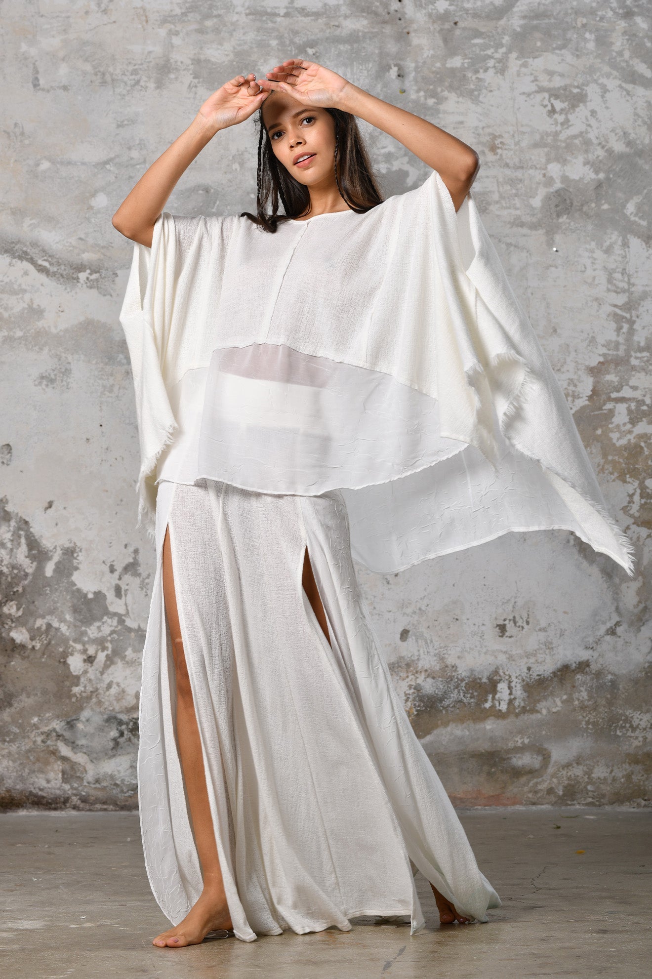 An enchanting Bohemian Leila, perfect for boho and festival-inspired looks, exuding a goddess-like quality. The flowy fabric and intricate side details create an ethereal, bohemian style perfect for Burning Man and other occasions. This garment is an ethically crafted gem. Menswear Boho Shirt. Boho sleeveless poncho unisex